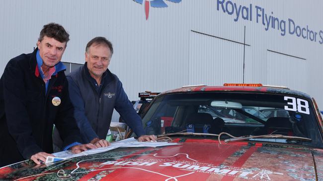 The Bush Summit Rally Car crew driver James Calvert-Jones, and co-driver Harley Kruse checking the days outback route. Picture: wrightphoto1@mac.com