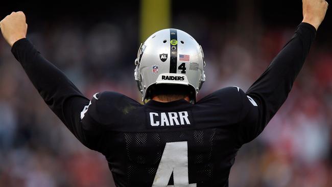 Derek Carr #4 of the Oakland Raiders celebrates beating the San Francisco 49ers.