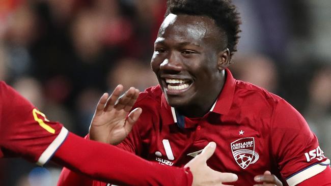 ADELAIDE, AUSTRALIA - MARCH 03:  Nestory Irankunda of Adelaide United celebrates a goal with  Craig Goodwin of United. during the round 19 A-League Men's match between Adelaide United and Melbourne City at Coopers Stadium, on March 03, 2023, in Adelaide, Australia. (Photo by Sarah Reed/Getty Images)