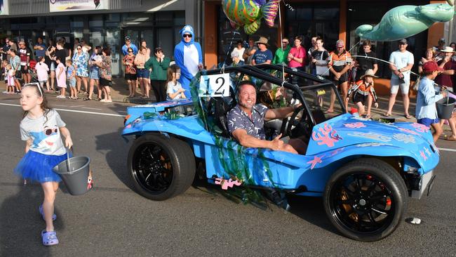 Hinchinbrook MP Nick Dametto and a little helper distributing candy outside his electorate office. Photographs from the Maraka Festival Street Parade around the Ingham central business district on Saturday. In an ‘Under the Sea’-themed celebration of all things Hinchinbrook, school students, community organisations, emergency responders and contestants vying for the prized Queen and Princess titles paraded around Rotary Park in the centre of the town. Picture: Cameron Bates