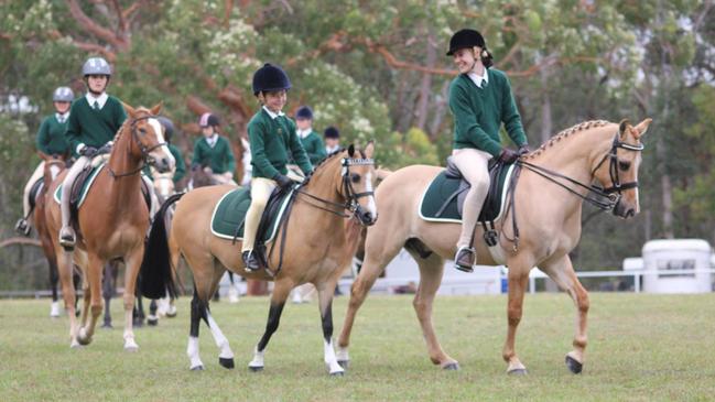 Hills District Pony Club members (Right to Left) Trista Mitchell, (looking back) Jett Newman, and Emma Galea.