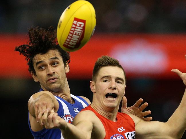 Alex Morgan of the Kangaroos (left) contests with Ben Ronke of the Swans during the Round 17 AFL match between the North Melbourne Kangaroos and the Sydney Swans at Etihad Stadium in Melbourne, Sunday, July 15, 2018. (AAP Image/Hamish Blair) NO ARCHIVING, EDITORIAL USE ONLY