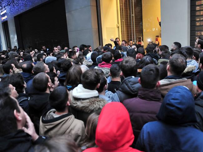 People queue outside a department store in Thessaloniki, Greece. Picture: AFP PHOTO / SAKIS MITROLIDIS