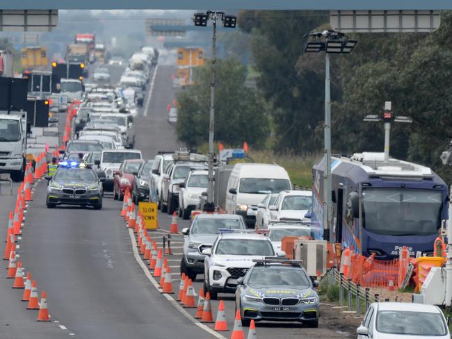 Traffic is banked up at a checkpoint on the Princes Freeway heading out of Melbourne towards Geelong at Little River. Picture: Andrew Henshaw