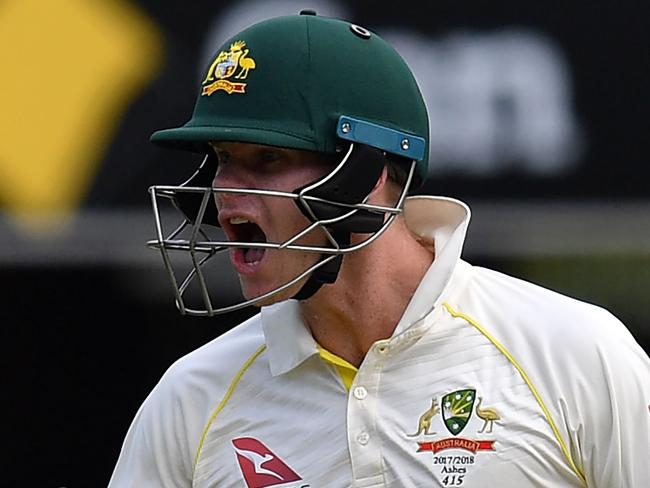 Australia's batsman Steve Smith celebrates his 100-runs on the third day of the first cricket Ashes Test between England and Australia in Brisbane on November 25, 2017.  / AFP PHOTO / SAEED KHAN / -- IMAGE RESTRICTED TO EDITORIAL USE - STRICTLY NO COMMERCIAL USE --