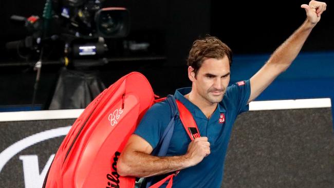 Switzerland's Roger Federer gestures to the crowd after losing to Greece's Stefanos Tsitsipas 