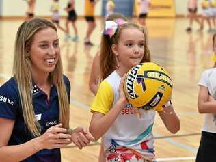 Sunshine Coast Lightning host a school holiday clinic at Caloundra Indoor Stadium. Cara Koenen with Mackenzie Lightfoot, 8. Picture: Patrick Woods