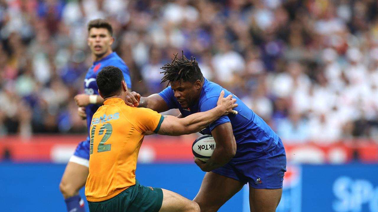 Jonathan Danty of France is tackled by Lalakai Foketi. (Photo by David Rogers/Getty Images)