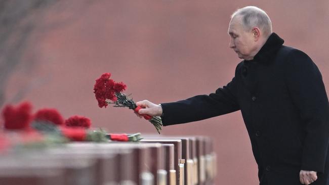 Vladimir Putin lays flowers at the Tomb of the Unknown Soldier. Picture: AFP