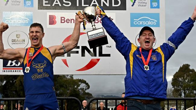 Noble Park captain Kyle Martin and coach Steve Hughes lift the 2022 Premier Division cup. Picture: Andy Brownbill