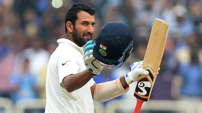 India's batsman Cheteshwar Pujara celebrates after scoring a double century during the fourth day of the third Test.