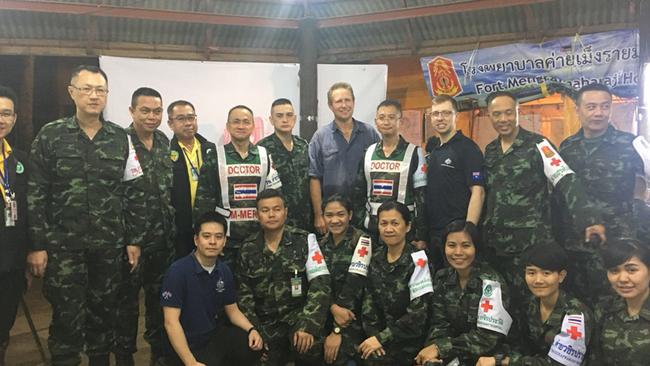 A supplied image obtained on Wednesday, July 11, 2018, of Australian doctor Richard Harris (centre),  and the medical team he worked with to assist in the rescue of 12 Thai boys who were stuck in an underground cave with their soccer coach, but have since been rescued. (AAP Image/Supplied by DFAT) NO ARCHIVING