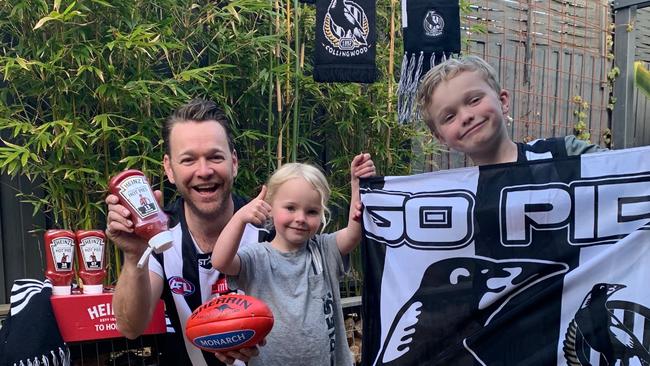 Brodie Young and his kids have had to support the Pies remotely this season. Brodie is normally the MC at Collingwood games in Melbourne. Picture: Brodie Young