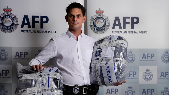 60-year-old Jose Lozano Garcia was caught at Cairns International Airport by Australian customs officials carrying 2.3kg of cocaine, which experts say would be worth about $1.6 million on the street. Federal Agent Ben Koch with the seized bags. Picture: Marc McCormack