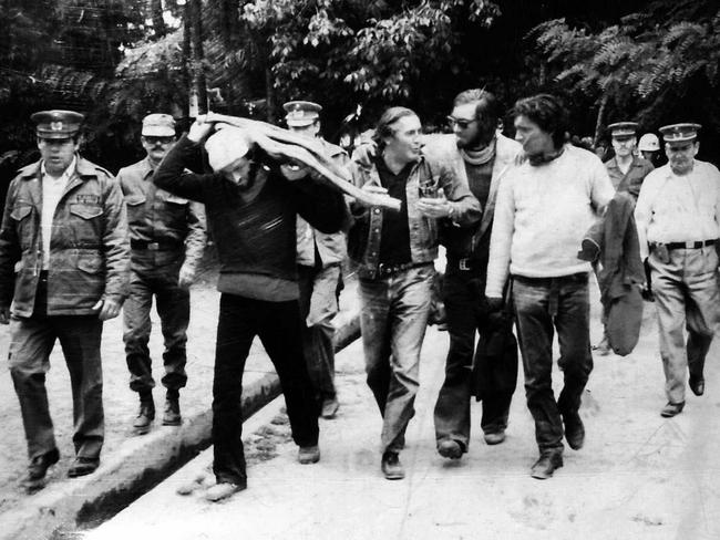 Rescued ... Survivor Nando Parrado (sunglasses) with two fellow survivors (white jumper and in cap), a family member and military officer after the rescue. Picture: Supplied