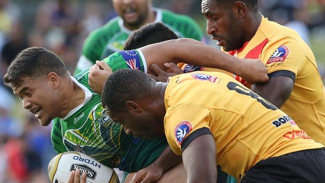 Esan Marsters of the Cook Islands is tackled during the Pacific Test match between the Cook Islands and the Papua New Guinea Kumuls at Campbelltown Stadium in Sydney, Saturday, May 6, 2017. (AAP Image/Craig Golding)