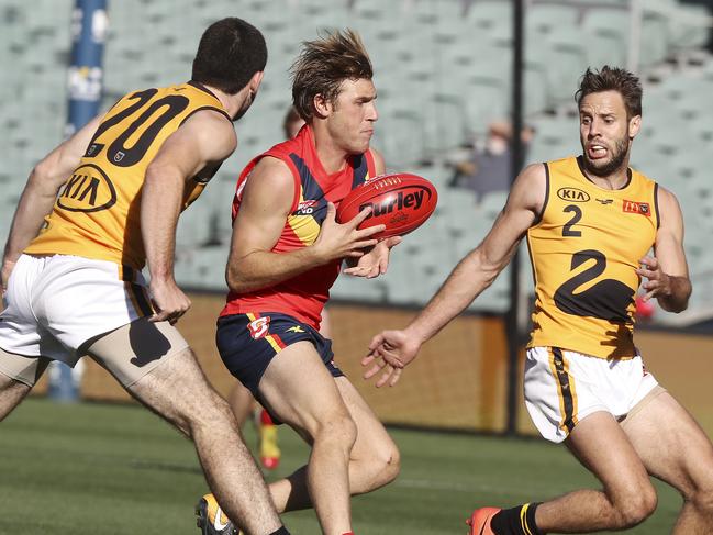 SANFL - STATE GAME - SA v WA at the Adelaide Oval. Sam Colquhoun under pressure from Blaine Johnson and Shane Nelson. Picture SARAH REED