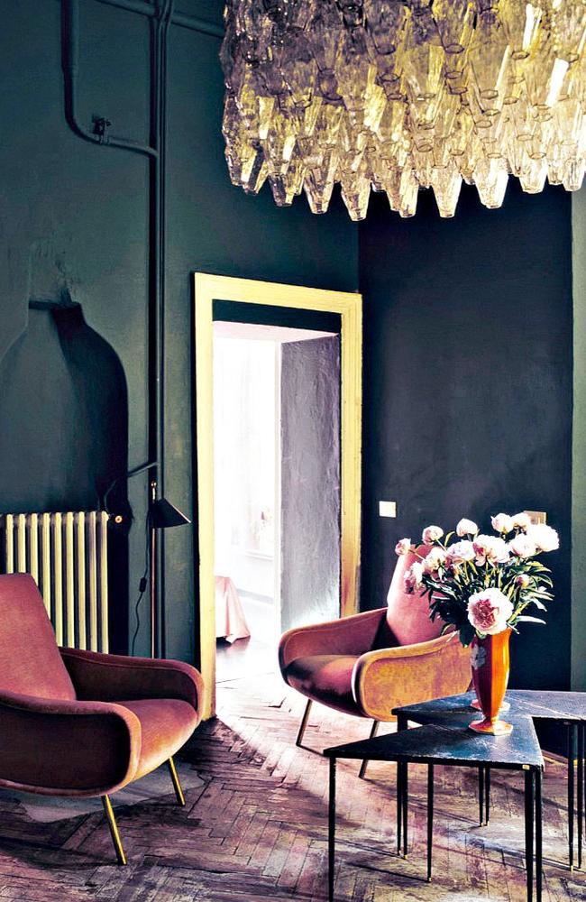 Blend the old with the new; dark walls modernise an antique-filled space. Picture: Dimore Interiors