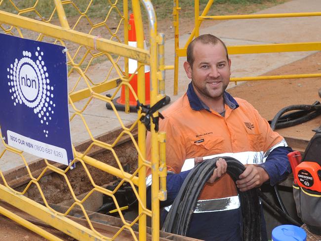 Trainee cable joiner Ewan Schmerl working on the NBN in Alice Springs.