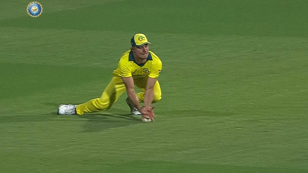 Marcus Stoinis claims a low catch to remove Shikhar Dhawan.