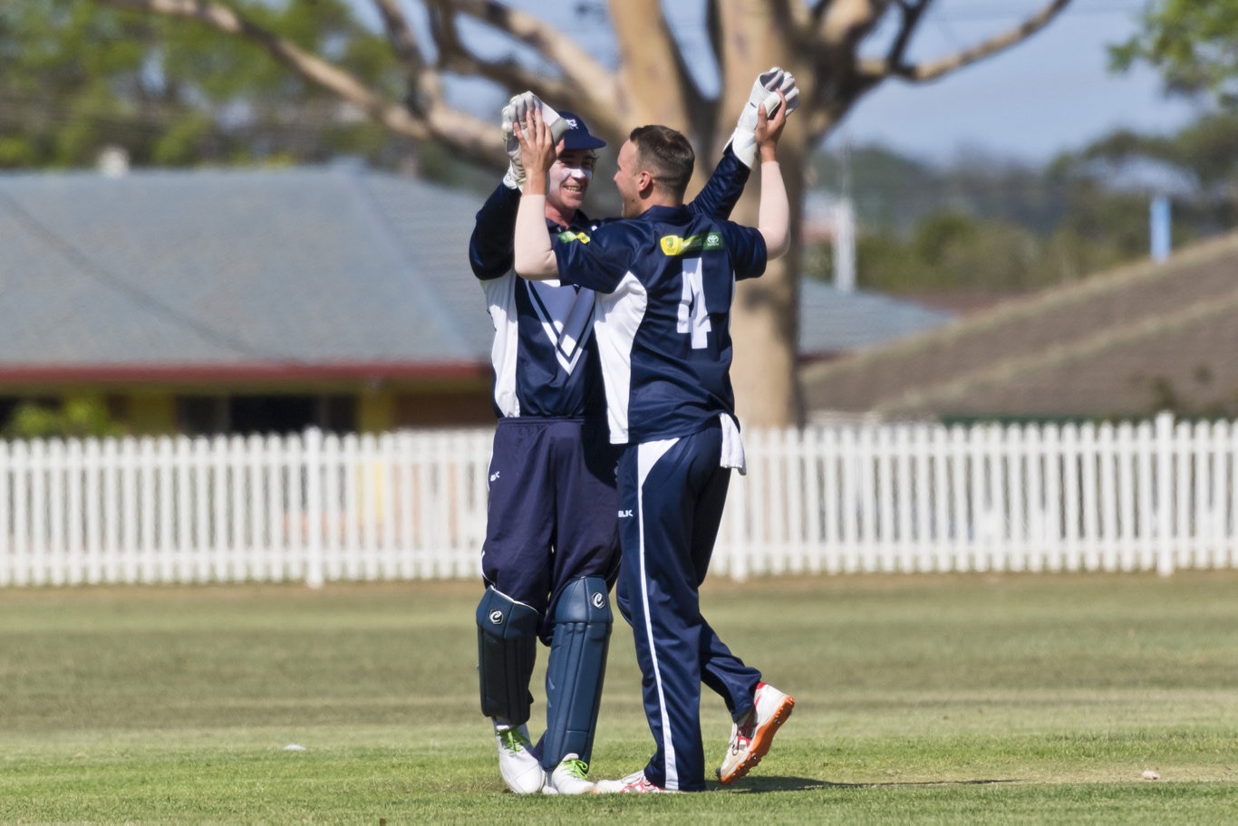 Victoria wicketkeeper Cameron Williams (left) celebrates the dismissal of Queensland's Sam Lowry with bowler Jack Wigglesworth in Australian Country Cricket Championships round two at Rockville Oval, Friday, January 3, 2020. Picture: Kevin Farmer