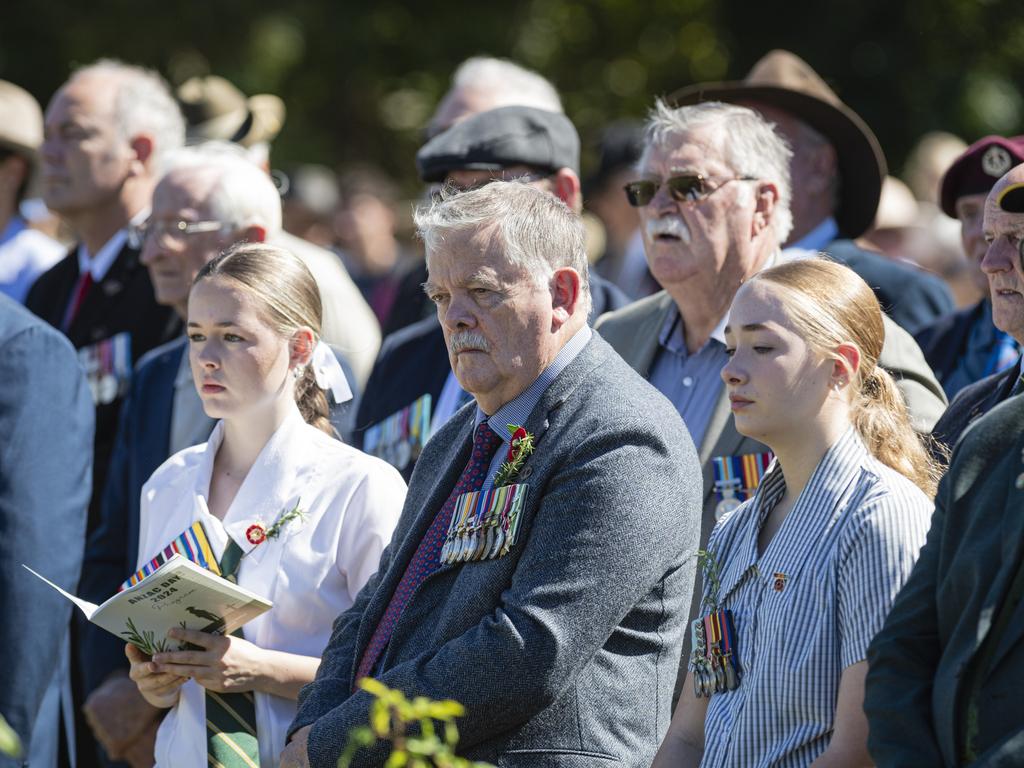 Vietnam veteran Norman Fry with granddaughters Aemilia Whiting (left) and Annie Whiting during Toowoomba's Anzac Day mid-morning service at the Mothers' Memorial, Thursday, April 25, 2024. Picture: Kevin Farmer