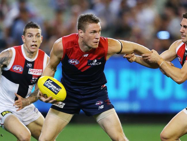 MELBOURNE, AUSTRALIA - APRIL 20: Jade Gresham tackles Tom McDonald of the Demons during the round 5 AFL match between Melbourne and St Kilda at Melbourne Cricket Ground on April 20, 2019 in Melbourne, Australia. (Photo by Michael Dodge/Getty Images)