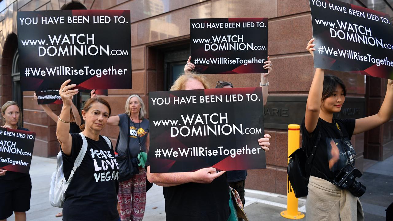 Animal rights protesters march through the business district in Sydney. Picture: AAP Image/Joel Carrett