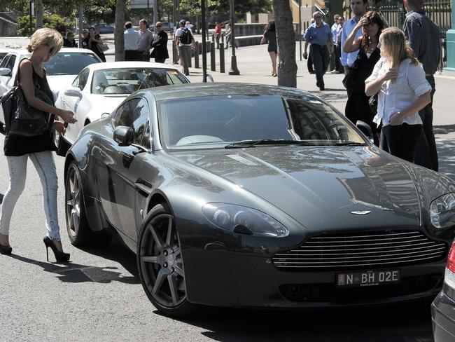 Lara Bingle and her Aston Martin. Picture: Paul McConnell/Snappermedia