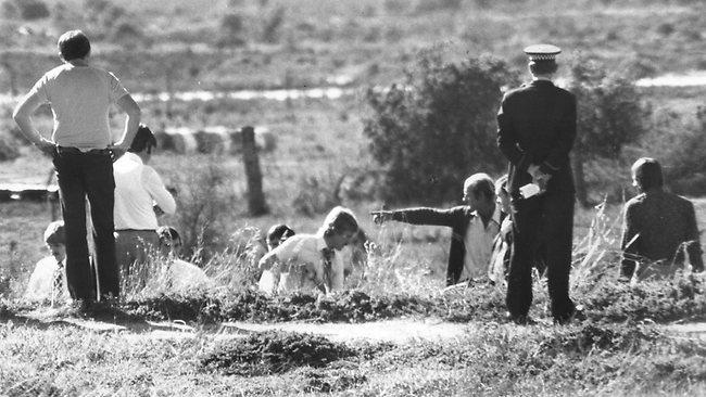 James William Miller is seen pointing at the scene of a police search for Truro murder victims in 1979. Picture: The Advertiser