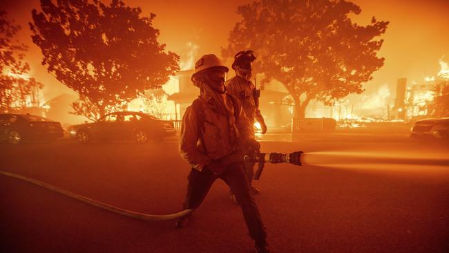 Firefighters battle the Palisades Fire as it burns multiple structures. Picture: AP