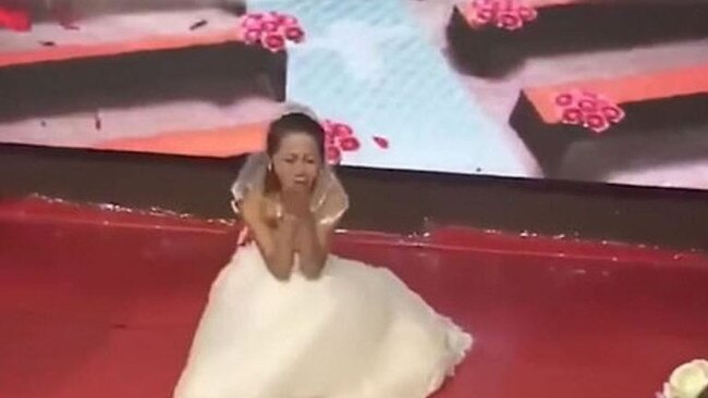 The ‘fake’ bride allegedly stormed into the ceremony before causing the cringe-worthy scene. Picture: Sina News