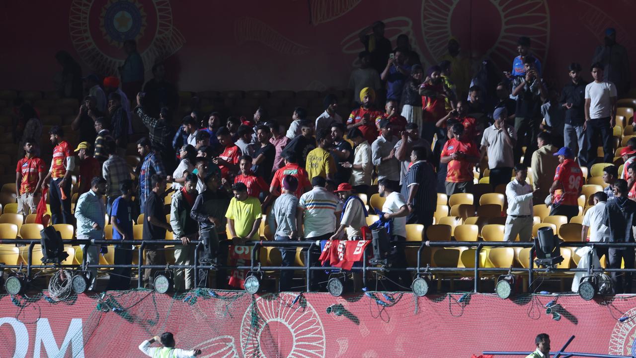 Spectators leave the stands after authorities evacuated the stadium during the 2025 IPL match between Punjab Kings and Delhi Capitals in Dharamsala, India. (Photo by Pankaj Nangia/Getty Images)