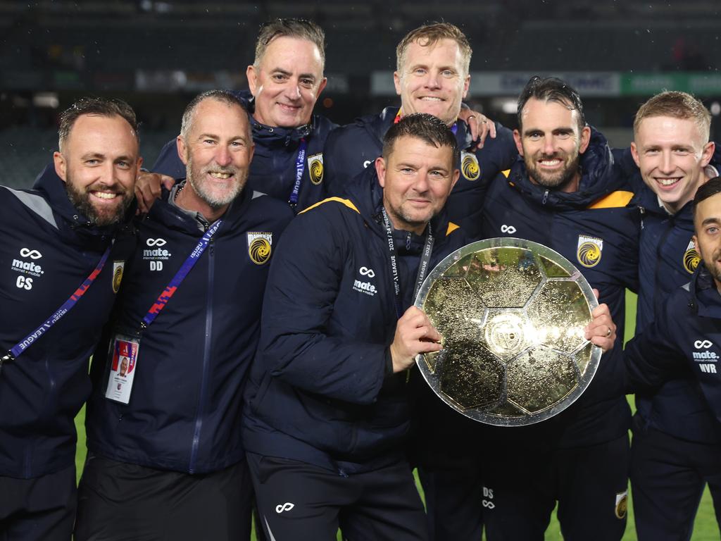 Mariners coach Mark Jackson (centre) celebrates Central Coast’s premiership win with his staff. Picture: Scott Gardiner/Getty Images