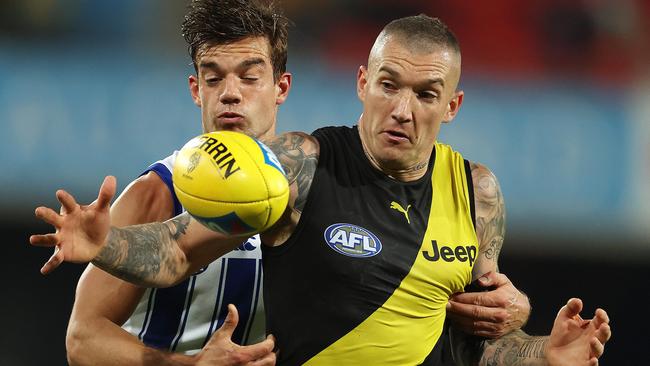 Dustin Martin is among the big AFL earners taking a huge pay cut.