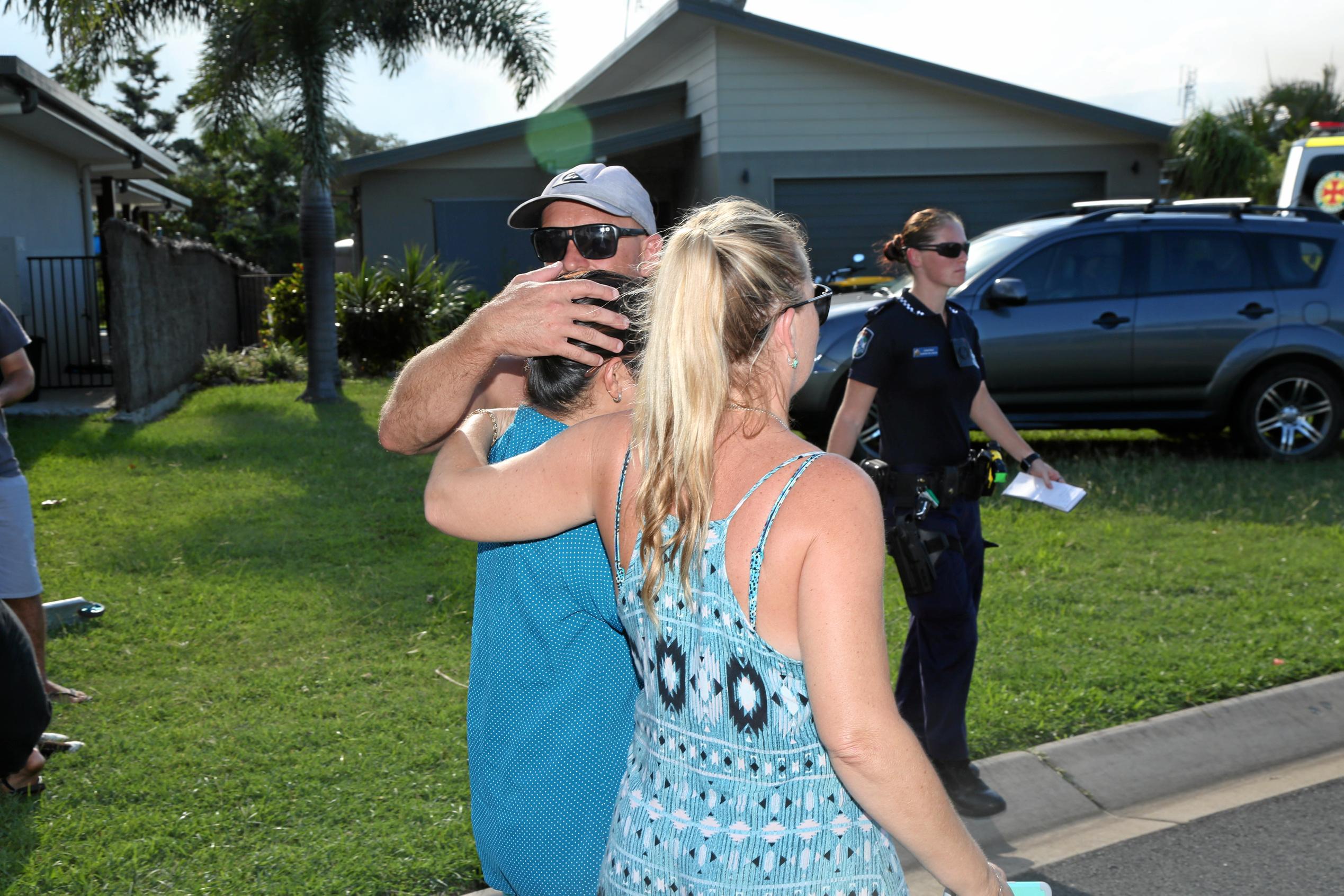 A shocked inhabitant returns to her in Waite Creek Ct home to find it in flames. Picture: PETER CARRUTHERS