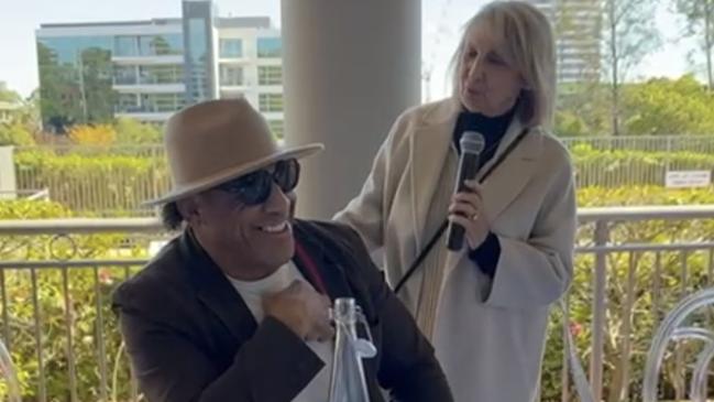 John Hopoate with a board member Rose Cantali of Business with a Heart at a high tea to raise awareness of the charity. Picture: Supplied.
