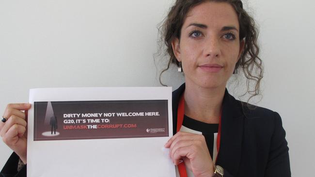 Transparency International spokeswoman Maggie Murphy with the rejected ad.