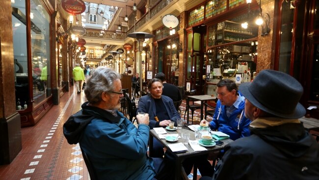 Sydneysiders enjoy an early morning coffee at The Strand Arcade in the CBD on Monday. Picture: Getty Images