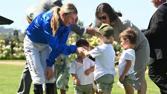 Jamie Kah with Dean Holland’s children after she won the Newmarket Handicap on Cylinder.