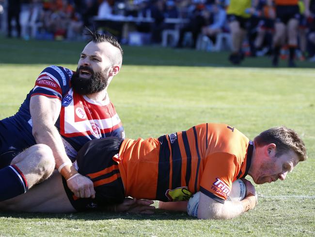 Camden’s Josh Goulton arrives too late to stop Ben Scambary from scoring The Oaks’ opening try in the first grade grand final. Picture Warren Gannon Photography