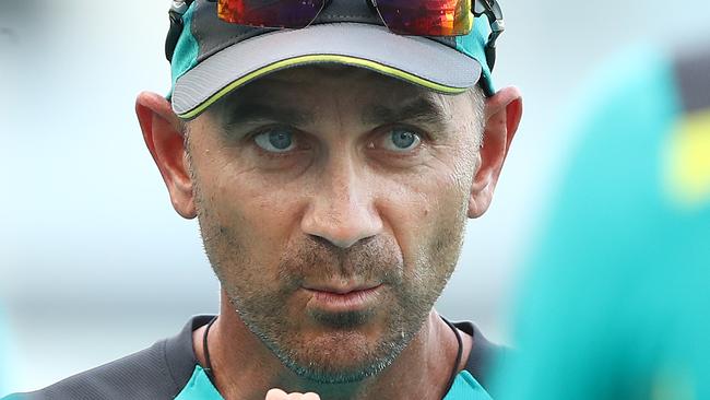 DUBAI, UNITED ARAB EMIRATES - OCTOBER 11: Justin Langer, coach of Australia, speaks to his players during day five of the First Test match in the series between Australia and Pakistan at Dubai International Stadium on October 11, 2018 in Dubai, United Arab Emirates. (Photo by Ryan Pierse/Getty Images)