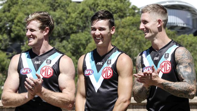 Port Adelaide captain Tom Jonas, Connor Rozee and Hamish Hartlett unveiled the club’s new sponsor, MG, ahead of the 2020 season. Picture: Sarah Reed