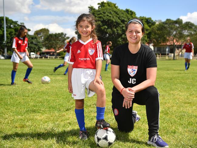 Pagewood Botany Football Club members Erin Jones and Coach Julia Chernoukha pose for a photo at Jellicoe Park in Pagewood, Sydney, Saturday, Nov. 11, 2017. (AAP Image/Joel Carrett)