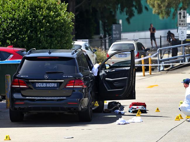 Hawi’s vehicle is examined by police after the shooting. Picture: Toby Zerna.