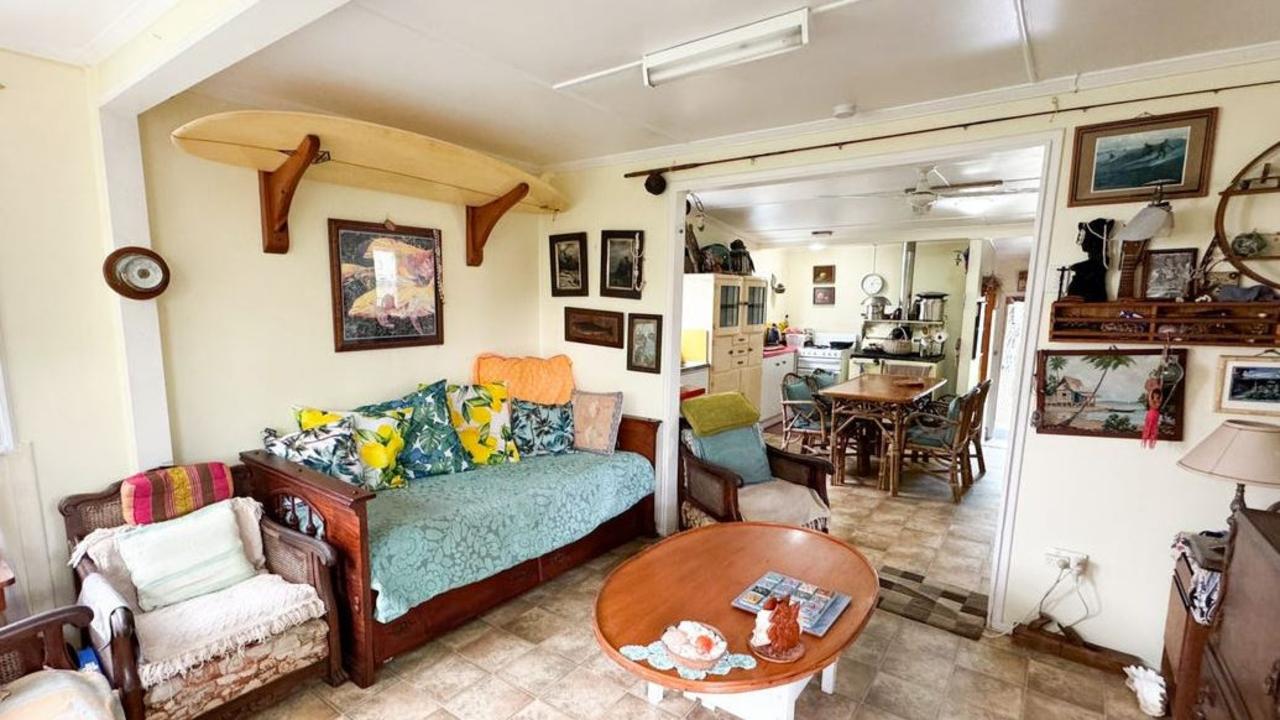 The two-bedroom beach shack is decorated with various surfboards and surfing memorabilia.