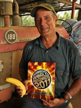 World record holder Graheme Celledoni with the 2011 book. He held the record for most bananas snapped in one minute.