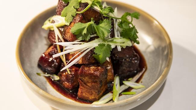 All fired up: Hot, numbing sweet and sour pork belly. Picture: Mark Cranitch.