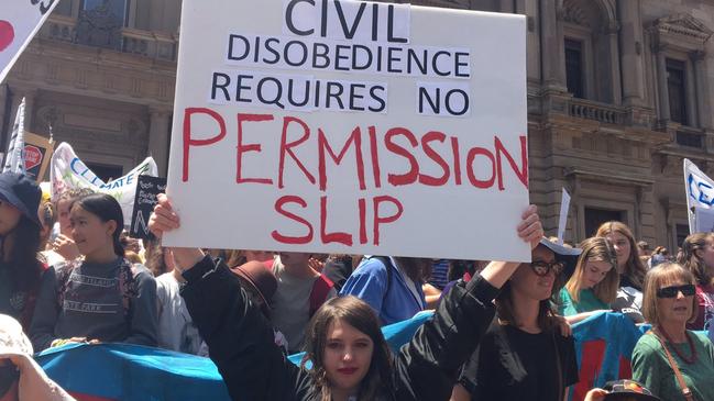 A young woman at the earlier strike.