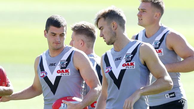 Tom Rockliff, left, with Dougal Howard at Port’s captain’s run at Adelaide Oval on Friday. Picture SARAH REED